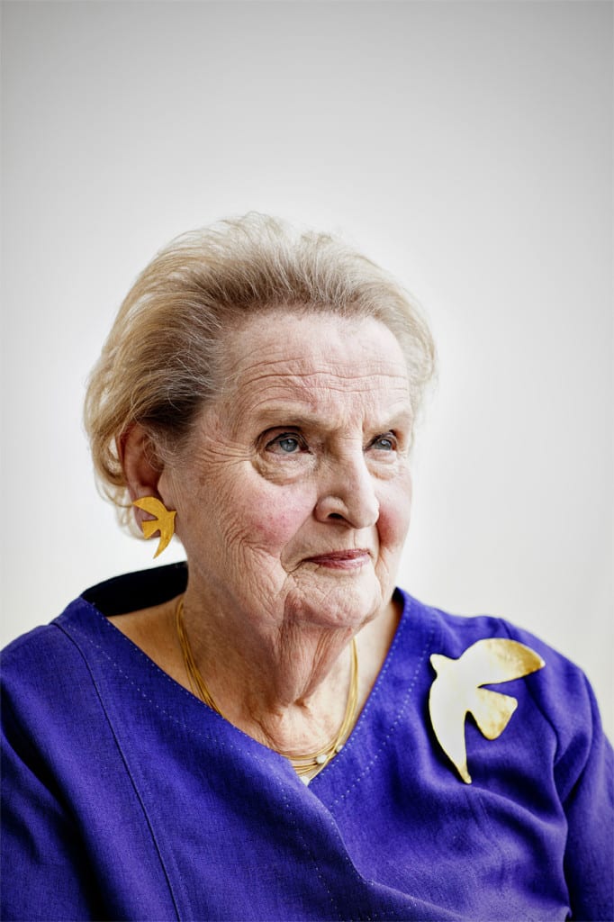 Madeleine Albright is photographed at the Albright Stonebridge Group offices in Washington, D.C. wearing a replica of the Cécile & Jeanne dove pin given to her by Leah Rabin. Albright's propensity for wearing pins that communicated subtle messages was well known during her tenure as Secretary of State.