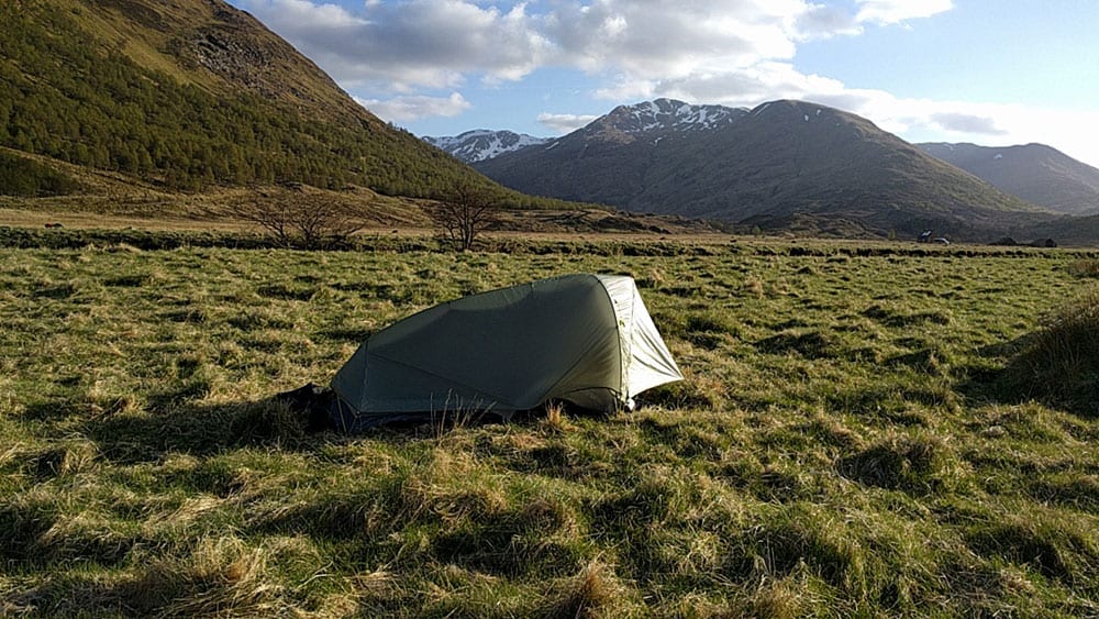 05.Alongside the River Affric, near Athnamulloch. Eighteen miles in. This was my room for the first night: a Mountain Hardware SuperMega Ultra-Light tent, all two pounds and two ounces of it. Those are the Glen Shiel mountains in front of me. It would get into the 20s on this night. I put on every stitch of clothing that I carried and zipped my wife’s sleeping bag around everything but my nose. I can say that it was wise not to have had any beer before pulling off this stunt. 