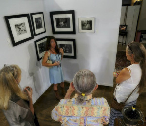 Amy Jasek talks about her work at the opening of “Family” in the new gallery space. Photo by Kevin Tully.