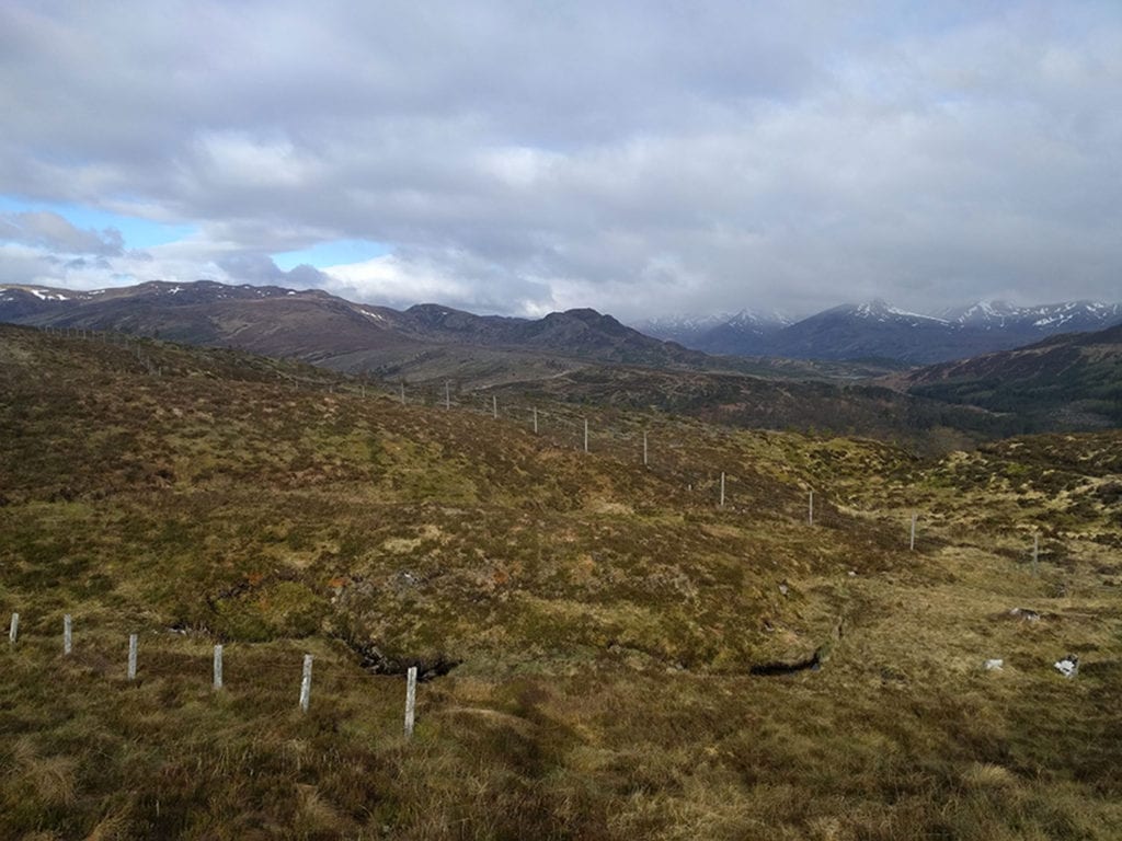 08.Bealach Feith na Gamhna, Highlands of Scotland. Thirty-one miles in. Earlier, I mentioned that I only carried a half bottle of water with me. Those cracks in the ground are running streams. Water is everywhere here and it is so clean that you can just dip your bottle in and drink away. On past long-distance hikes in other parts of the world, I typically had to carry up to ten pounds of water with me at all times. Not in Scotland.