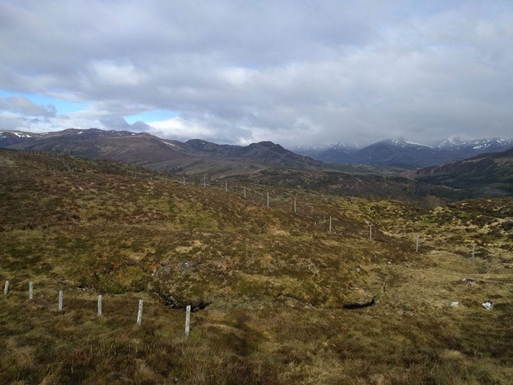 08.Bealach Feith na Gamhna, Highlands of Scotland. Thirty-one miles in. Earlier, I mentioned that I only carried a half bottle of water with me. Those cracks in the ground are running streams. Water is everywhere here and it is so clean that you can just dip your bottle in and drink away. On past long-distance hikes in other parts of the world, I typically had to carry up to ten pounds of water with me at all times. Not in Scotland. 